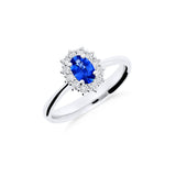 Anillo Roseta con Zafiro Talla Oval y Diamantes en Oro Blanco
