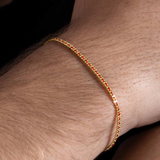 Pulsera Aurore de Redline Oro Amarillo Hilo Rojo