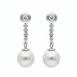 Pendientes largos de oro blanco con perlas y diamantes